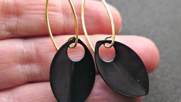 unique black dangle earring with gold earwires. modern anodized aluminum jewelry. splurge.