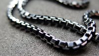 anodized aluminum jewelry. black necklace with silver edge. made in Canada.