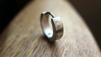 silver hoop earring for men. men's jewelry in brushed stainless steel.