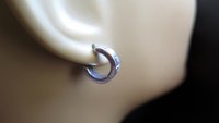 silver hoop earring for men. men's jewelry in brushed stainless steel.