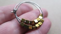 gold and silver earrings. hypoallergenic niobium hoops for sensitive ears.