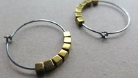 gold and silver earrings. hypoallergenic niobium hoops for sensitive ears.