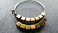 gold and silver earrings. hypoallergenic niobium hoops for sensitive ears.