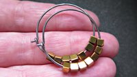 gold and silver earrings. hypoallergenic niobium hoops for sensitive ears.