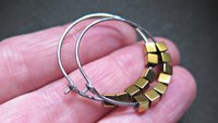 gold and silver earrings. hypoallergenic niobium hoops for sensitive ears.