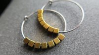 gold and silver earrings. hypoallergenic niobium hoops for sensitive ears.