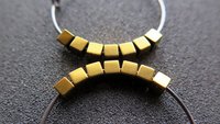 gold and silver earrings. hypoallergenic niobium hoops for sensitive ears.