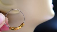 gold and silver earrings. hypoallergenic niobium hoops for sensitive ears.