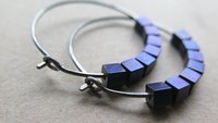 indigo earrings with hematite cubes. hypoallergenic niobium hoops for sensitive ears. modern purple blue jewelry.