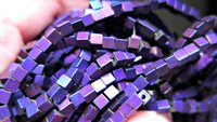 indigo earrings with hematite cubes. hypoallergenic niobium hoops for sensitive ears. modern purple blue jewelry.