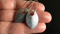 feather earring in anodized aluminum. sterling silver dangle earrings.