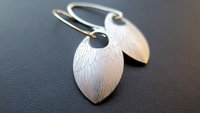 feather earring in anodized aluminum. sterling silver dangle earrings.