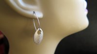 feather earring in anodized aluminum. sterling silver dangle earrings.