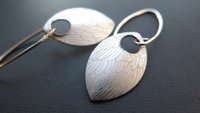 feather earring in anodized aluminum. sterling silver dangle earrings.