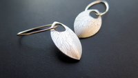 feather earring in anodized aluminum. sterling silver dangle earrings.