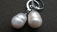 white pearl drop earrings. large freshwater pearl dangles. hypoallergenic stainless steel hoops. made in Canada.