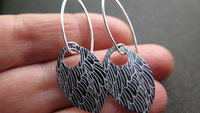 black wing earrings. anodized aluminum jewelry. sterling silver ear wire. splurge.