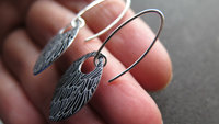black wing earrings. anodized aluminum jewelry. sterling silver ear wire. splurge.