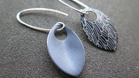 black wing earrings. anodized aluminum jewelry. sterling silver ear wire. splurge.
