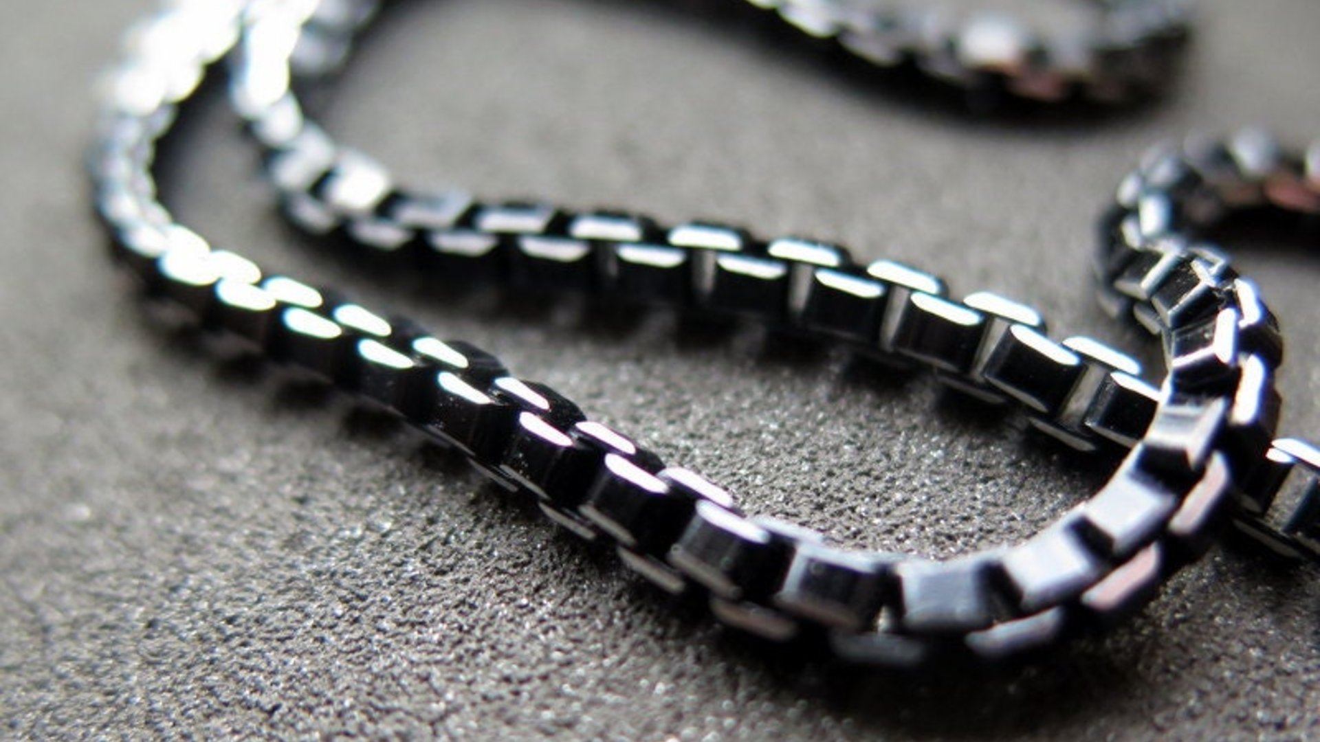anodized aluminum jewelry. black necklace with silver edge. made in Canada.