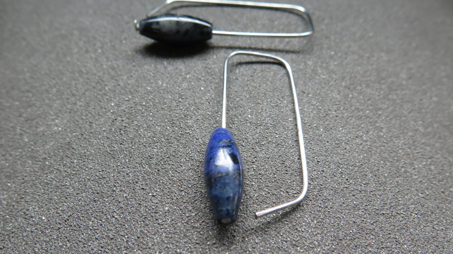 blue sodalite earrings. hypoallergenic stainless steel jewelry for sensitive ears. navy blue and black stones.