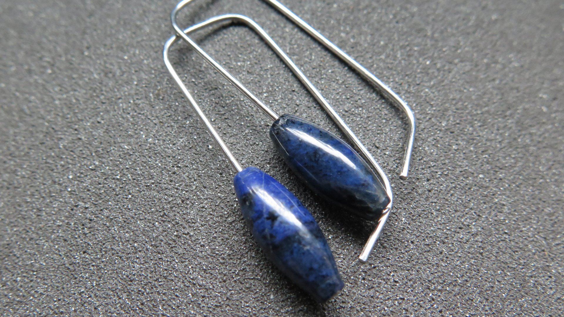 blue sodalite earrings. hypoallergenic stainless steel jewelry for sensitive ears. navy blue and black stones.