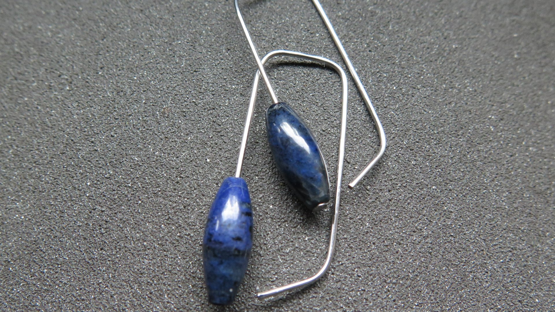 blue sodalite earrings. hypoallergenic stainless steel jewelry for sensitive ears. navy blue and black stones.