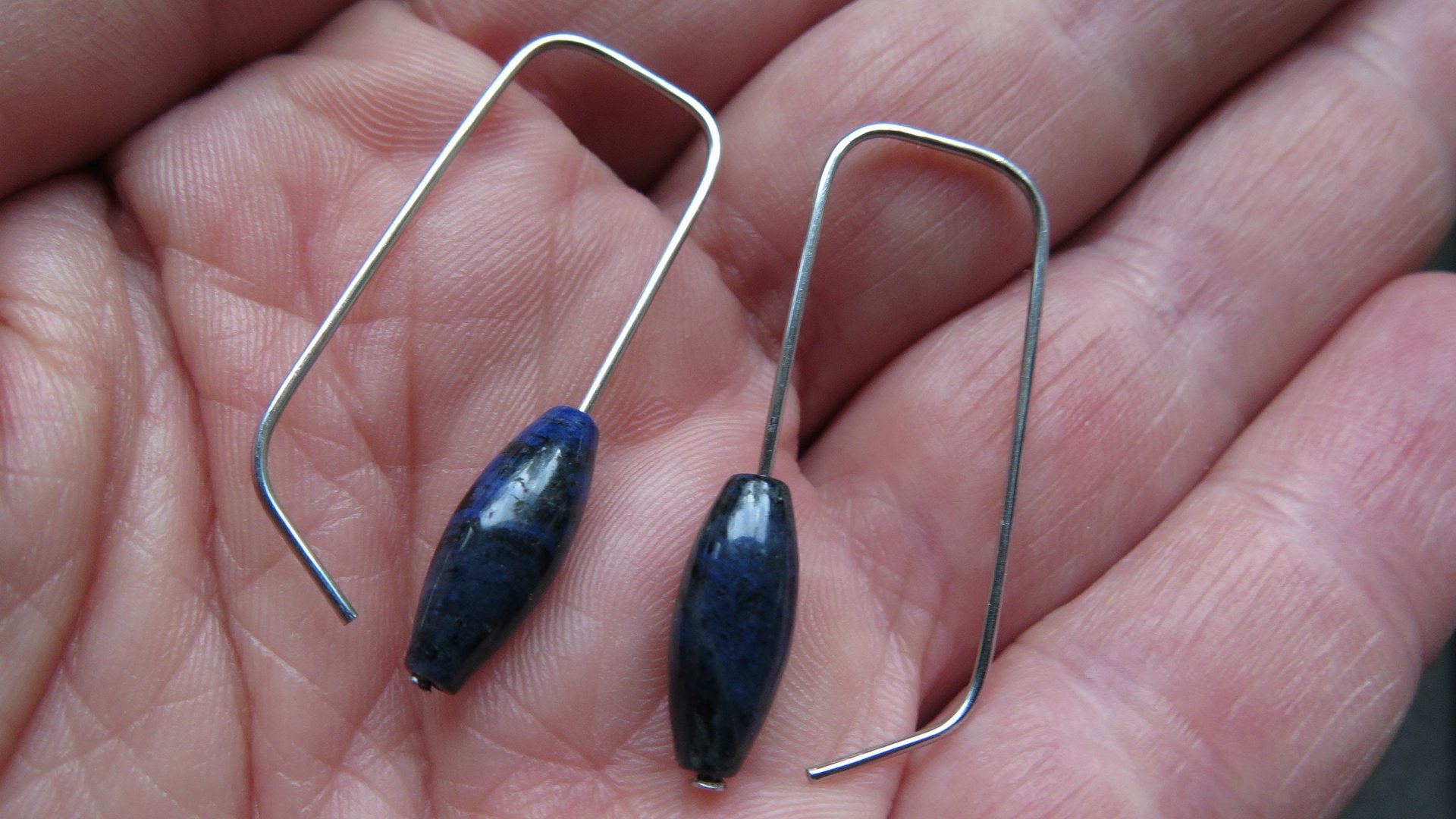 blue sodalite earrings. hypoallergenic stainless steel jewelry for sensitive ears. navy blue and black stones.
