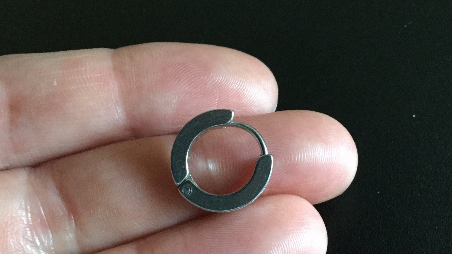 silver hoop earring for men. men's jewelry in brushed stainless steel.
