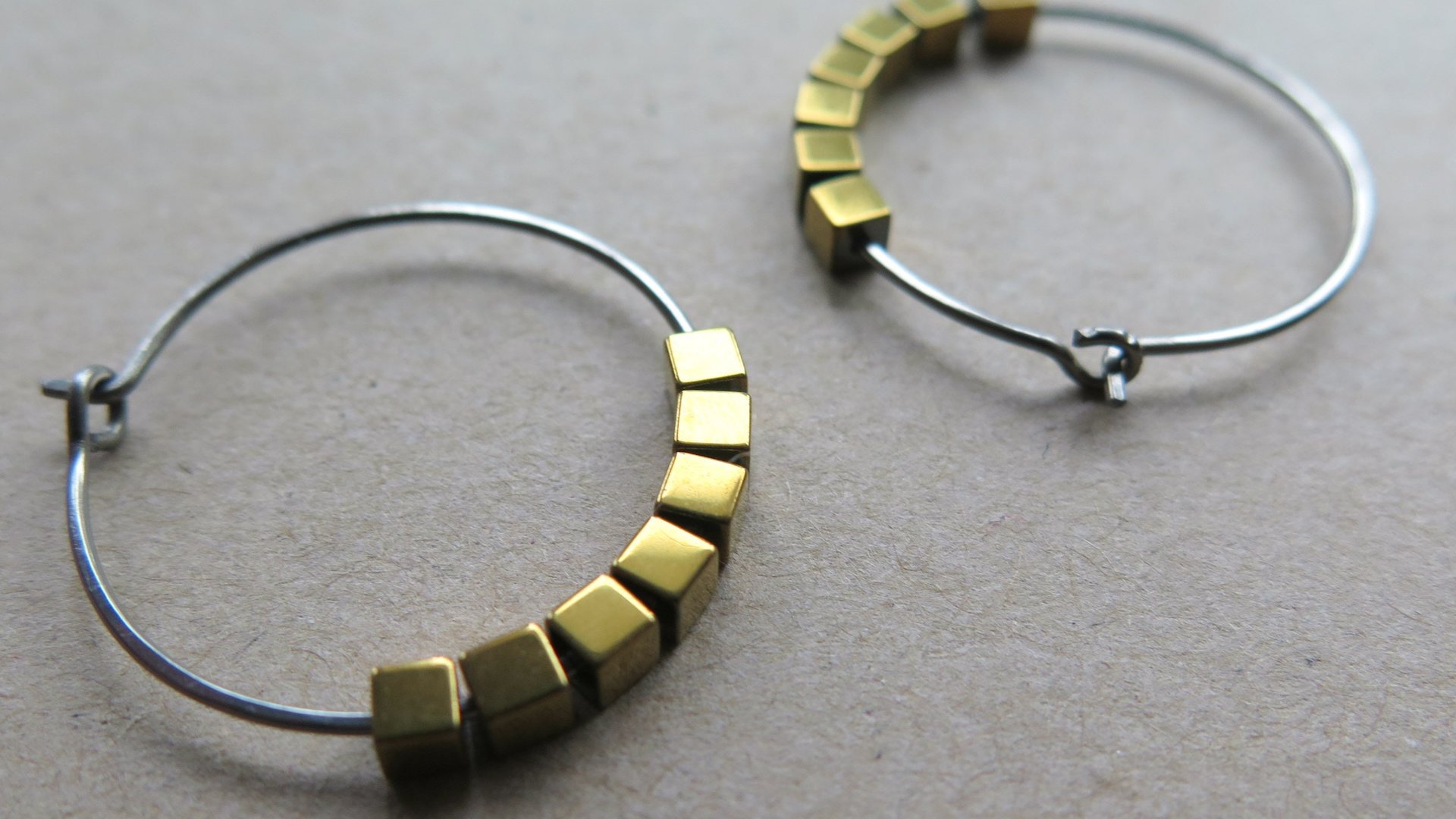 gold and silver earrings. hypoallergenic niobium hoops for sensitive ears.