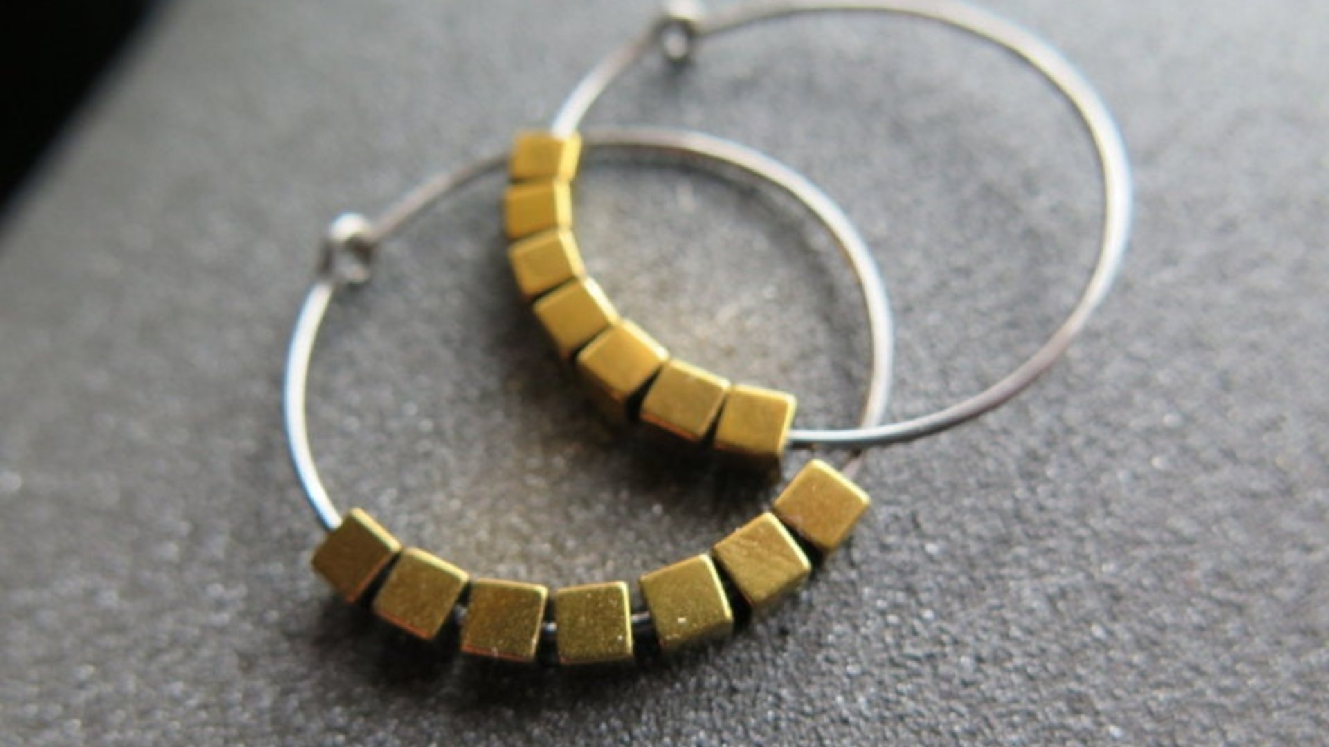 gold and silver earrings. hypoallergenic niobium hoops for sensitive ears.