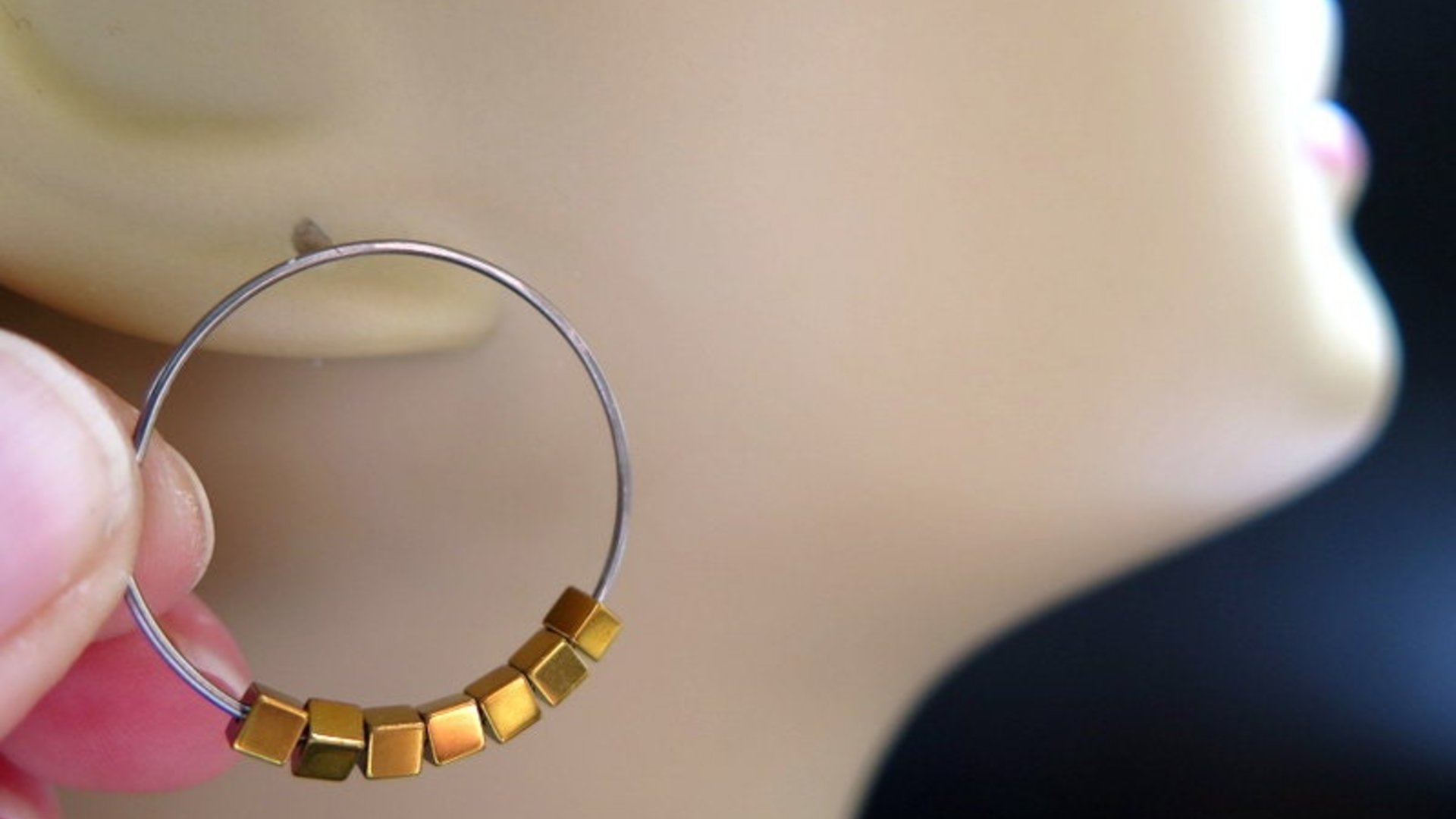 gold and silver earrings. hypoallergenic niobium hoops for sensitive ears.