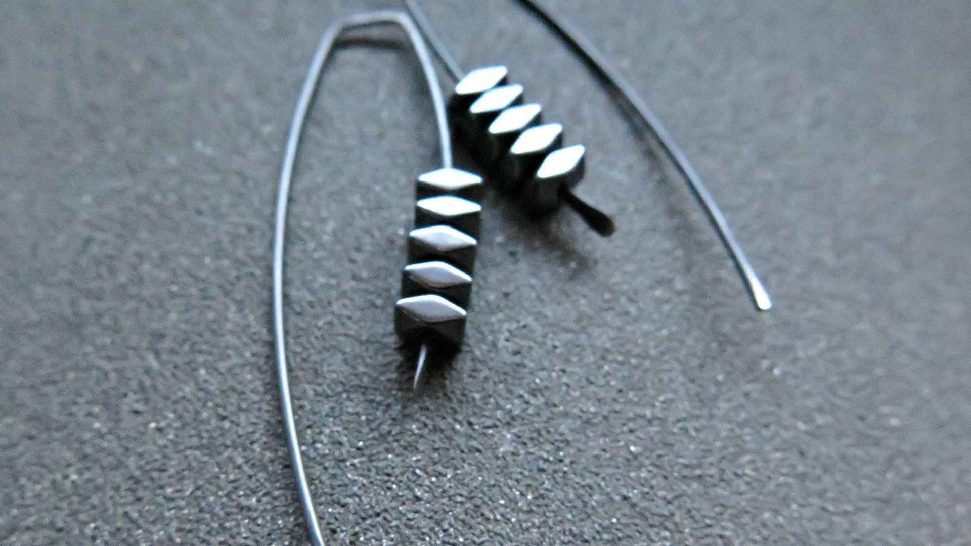 black earrings. hematite earrings in anodized niobium. hypoallergenic earwires.