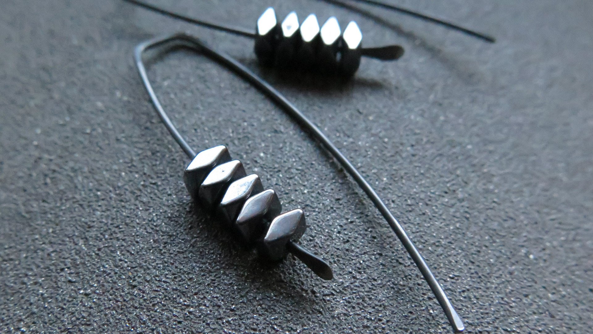 black earrings. hematite earrings in anodized niobium. hypoallergenic earwires.