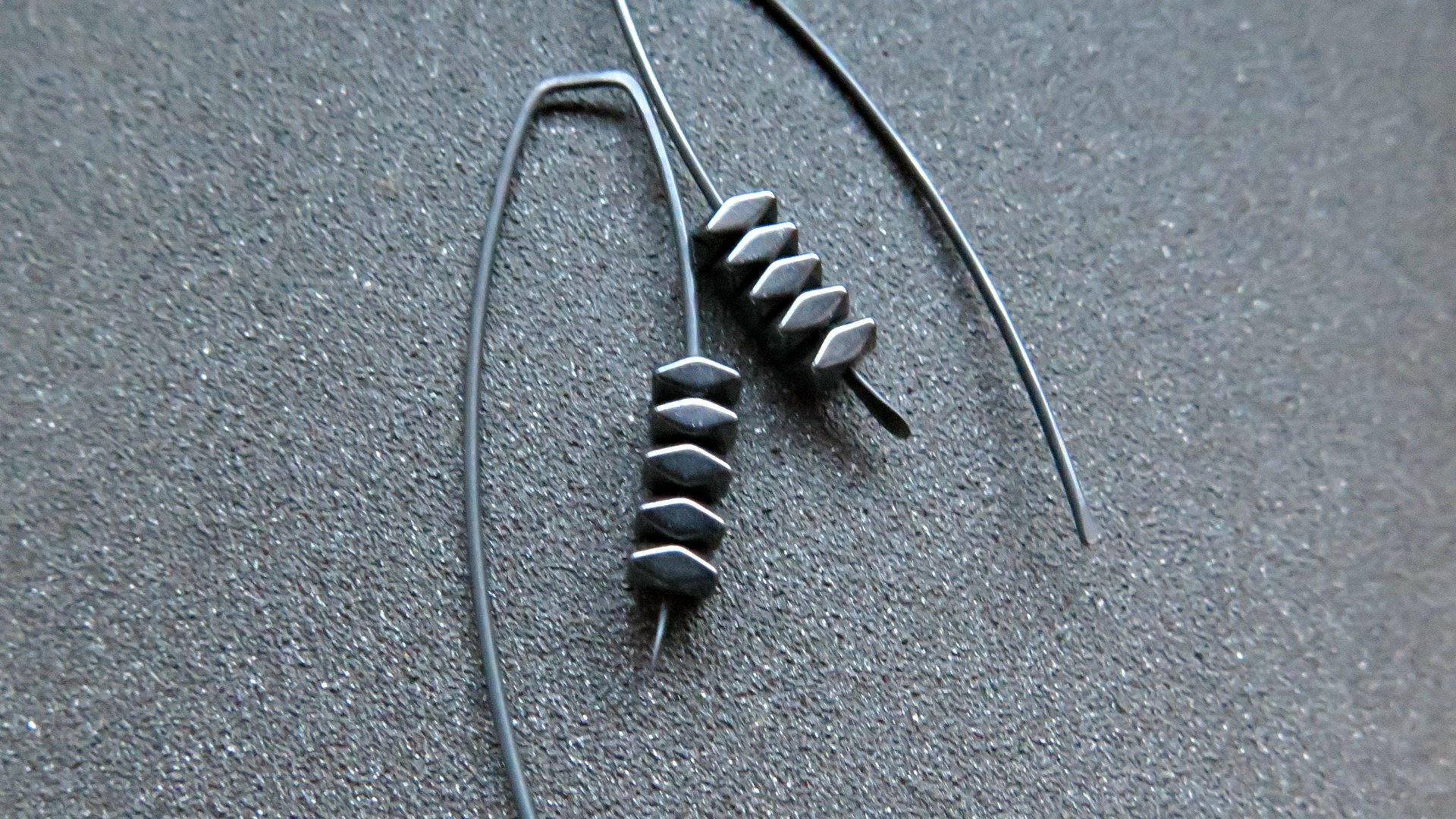 black earrings. hematite earrings in anodized niobium. hypoallergenic earwires.