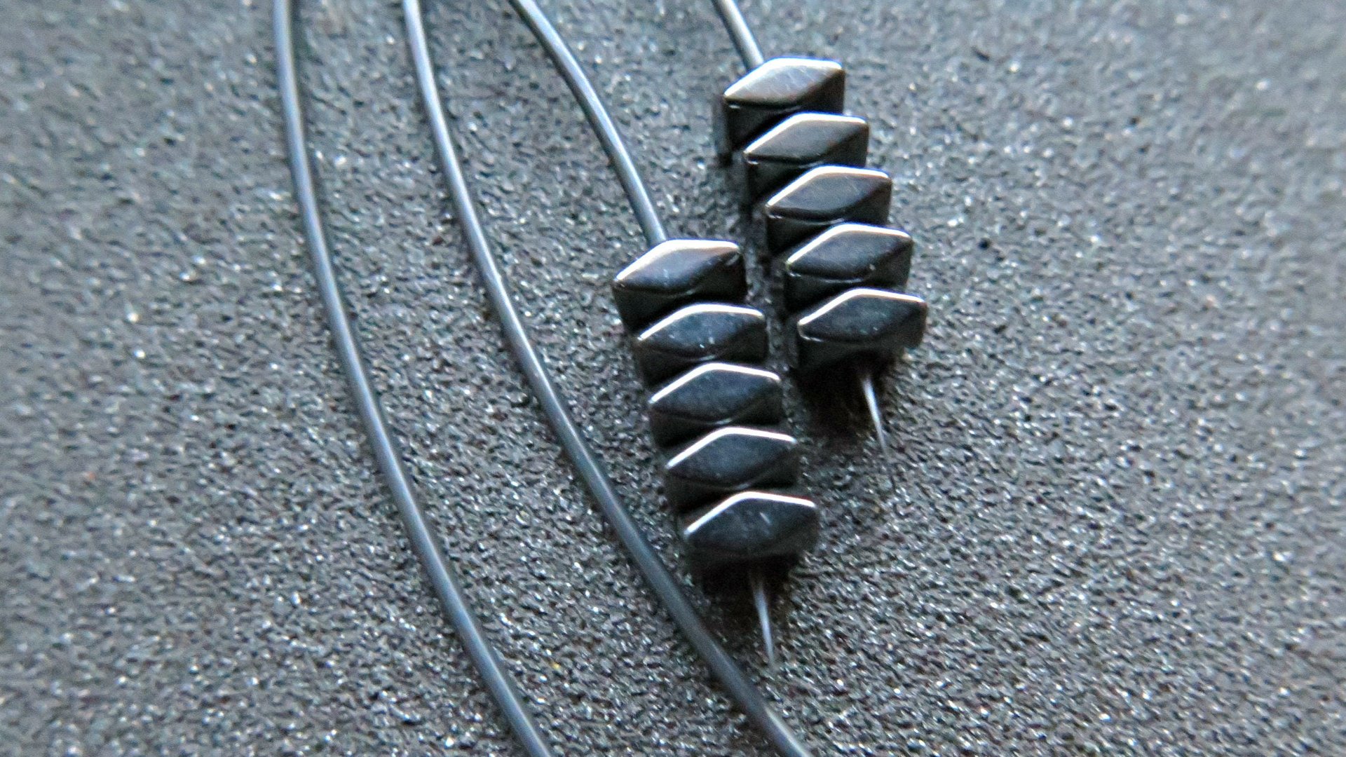black earrings. hematite earrings in anodized niobium. hypoallergenic earwires.