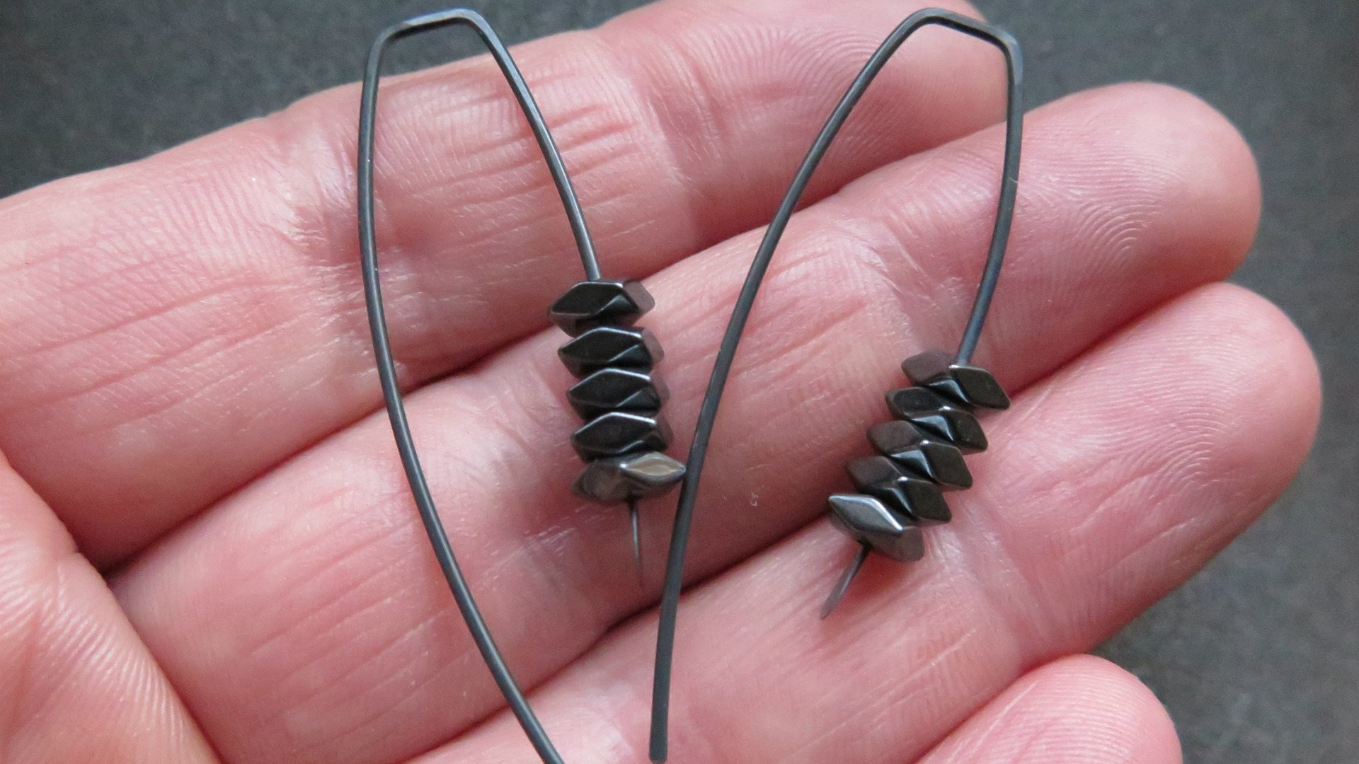 black earrings. hematite earrings in anodized niobium. hypoallergenic earwires.