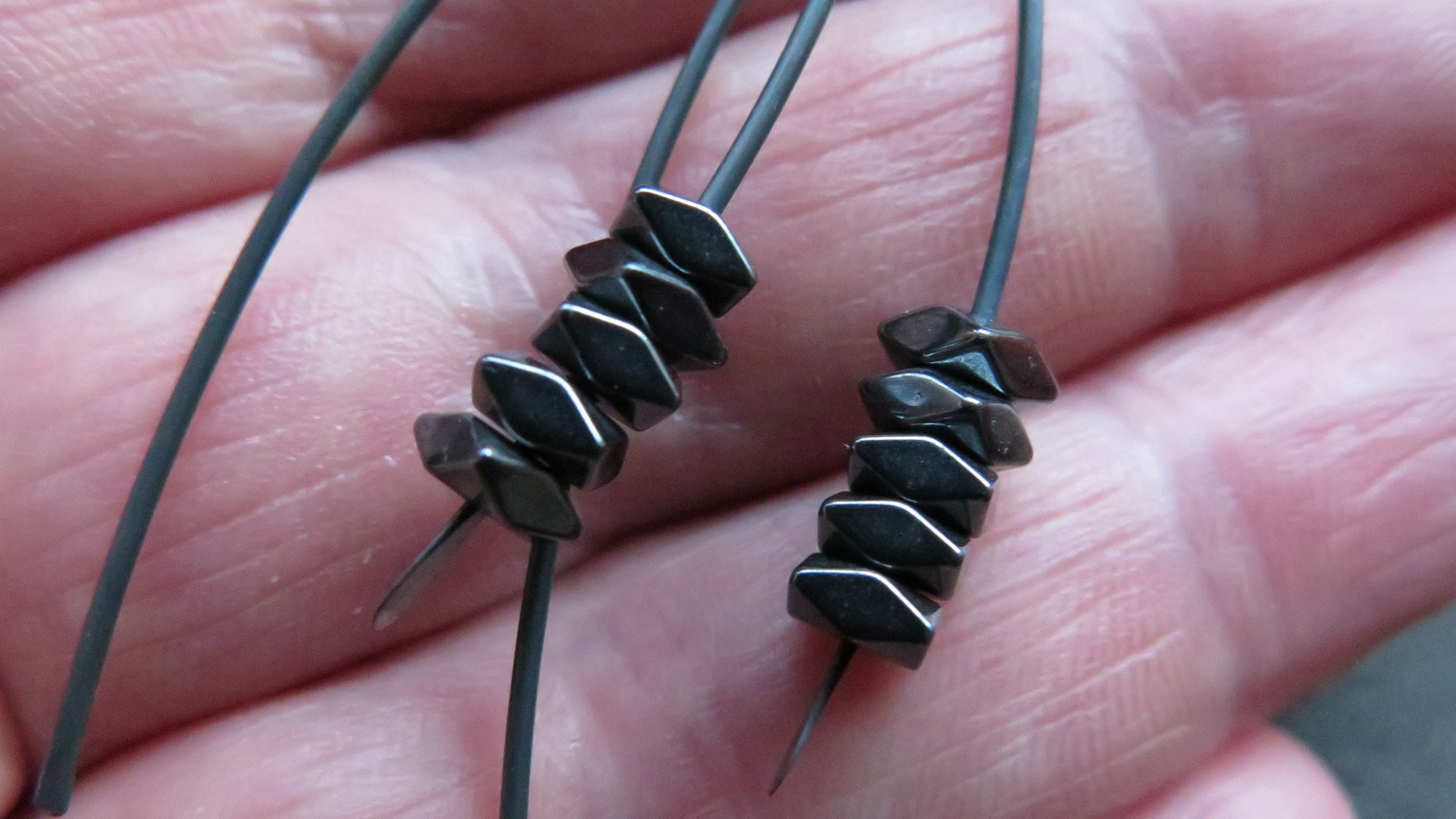 black earrings. hematite earrings in anodized niobium. hypoallergenic earwires.
