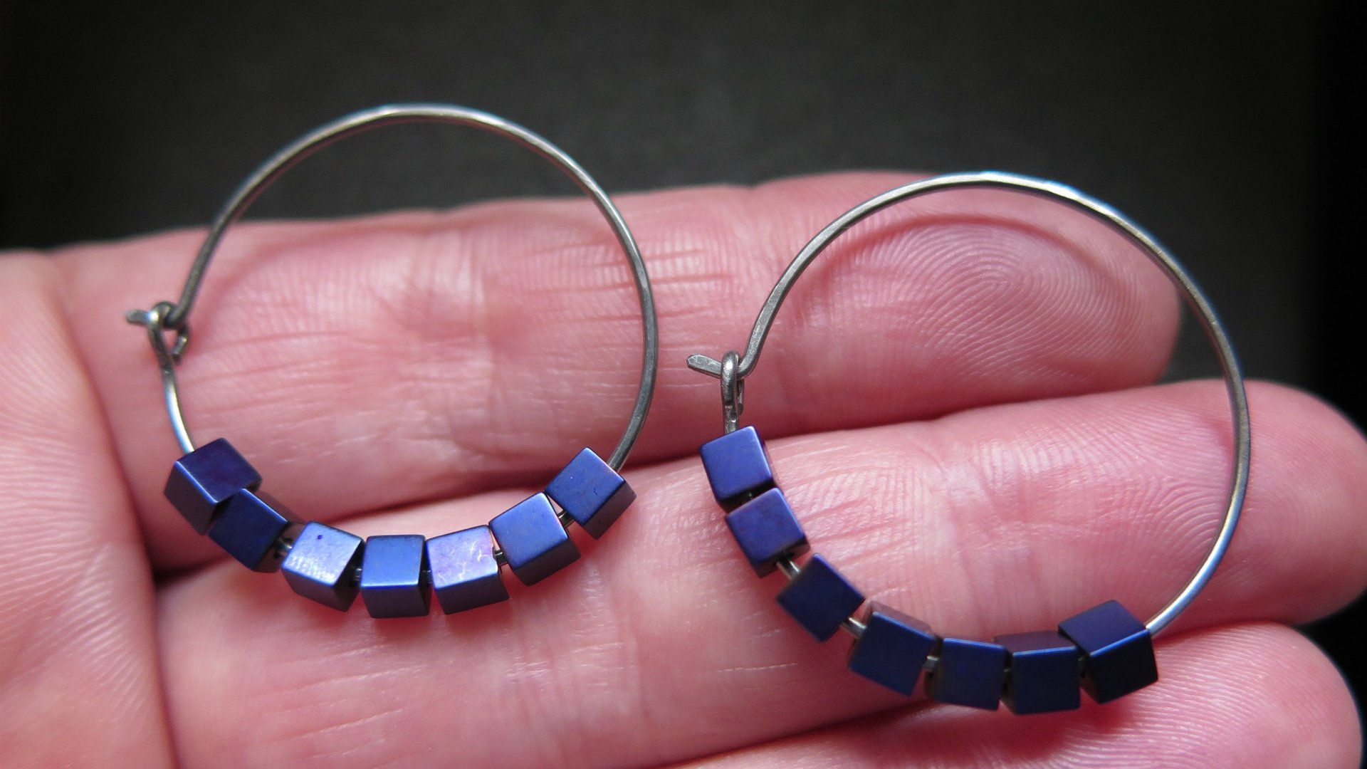 indigo earrings with hematite cubes. hypoallergenic niobium hoops for sensitive ears. modern purple blue jewelry.