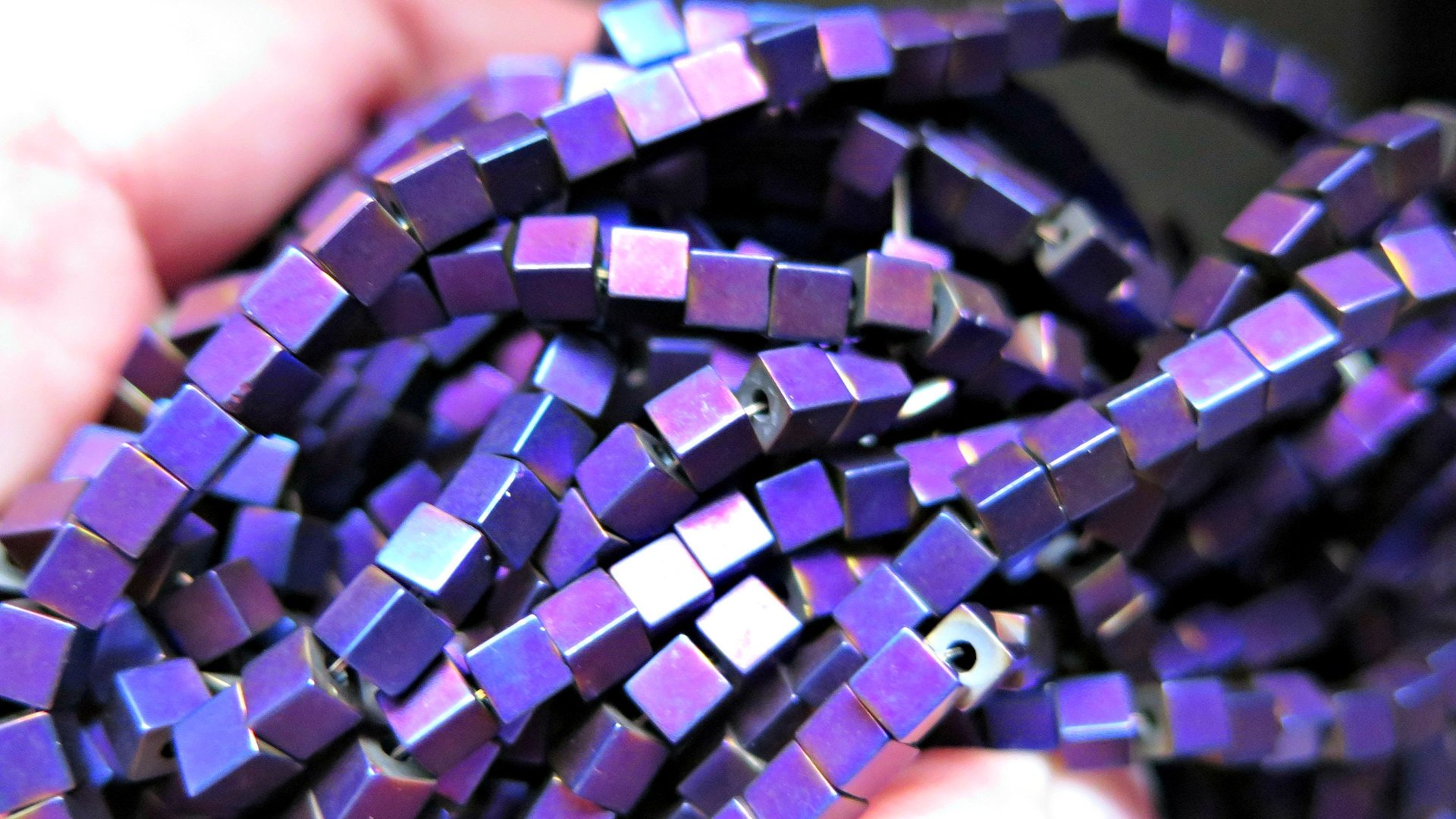indigo earrings with hematite cubes. hypoallergenic niobium hoops for sensitive ears. modern purple blue jewelry.