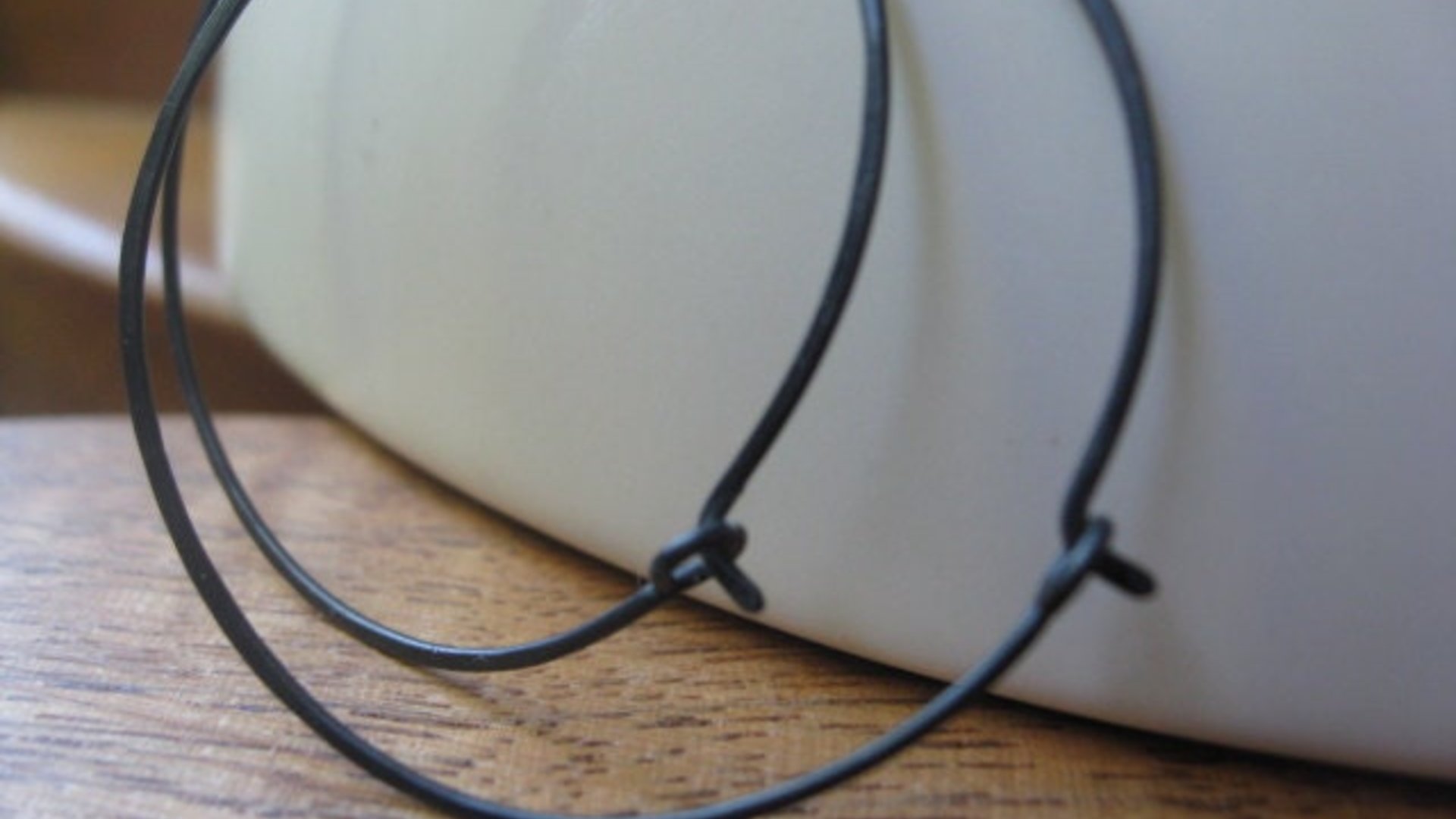 black hoop earrings. hammered niobium hoops. hypoallergenic jewelry. made in Calgary, Alberta.
