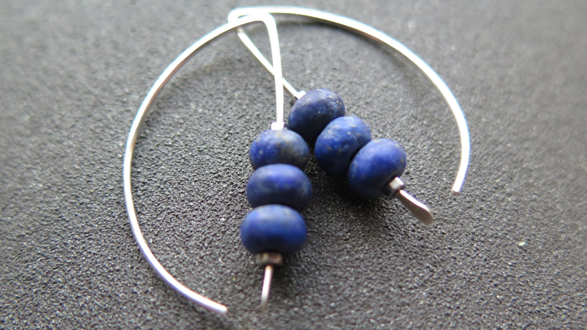 lapis earrings. cobalt blue earring. genuine lapis lazuli jewelry. dark blue stones with a matte polish.