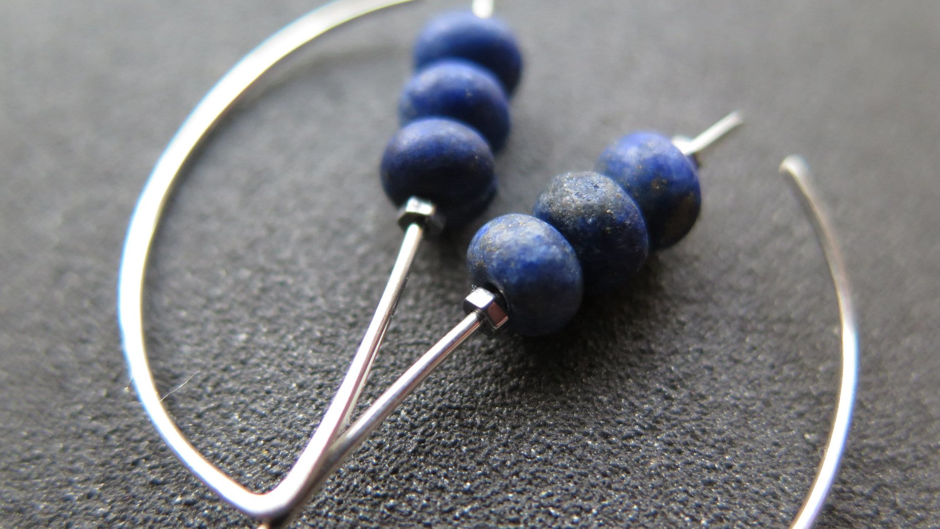 lapis earrings. cobalt blue earring. genuine lapis lazuli jewelry. dark blue stones with a matte polish.