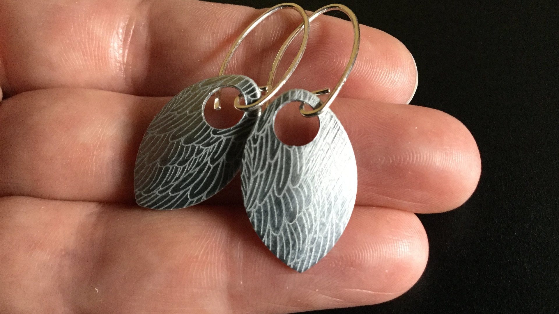 feather earring in anodized aluminum. sterling silver dangle earrings.