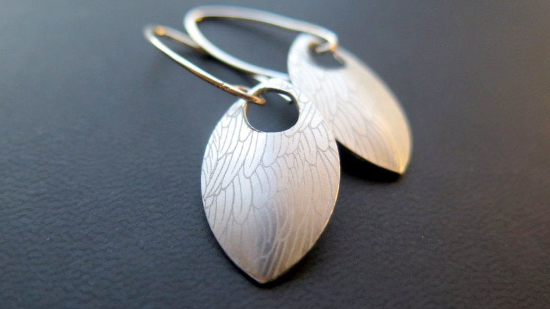 feather earring in anodized aluminum. sterling silver dangle earrings.