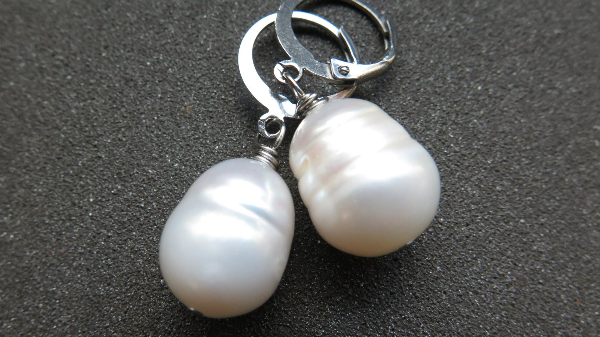 white pearl drop earrings. large freshwater pearl dangles. hypoallergenic stainless steel hoops. made in Canada.