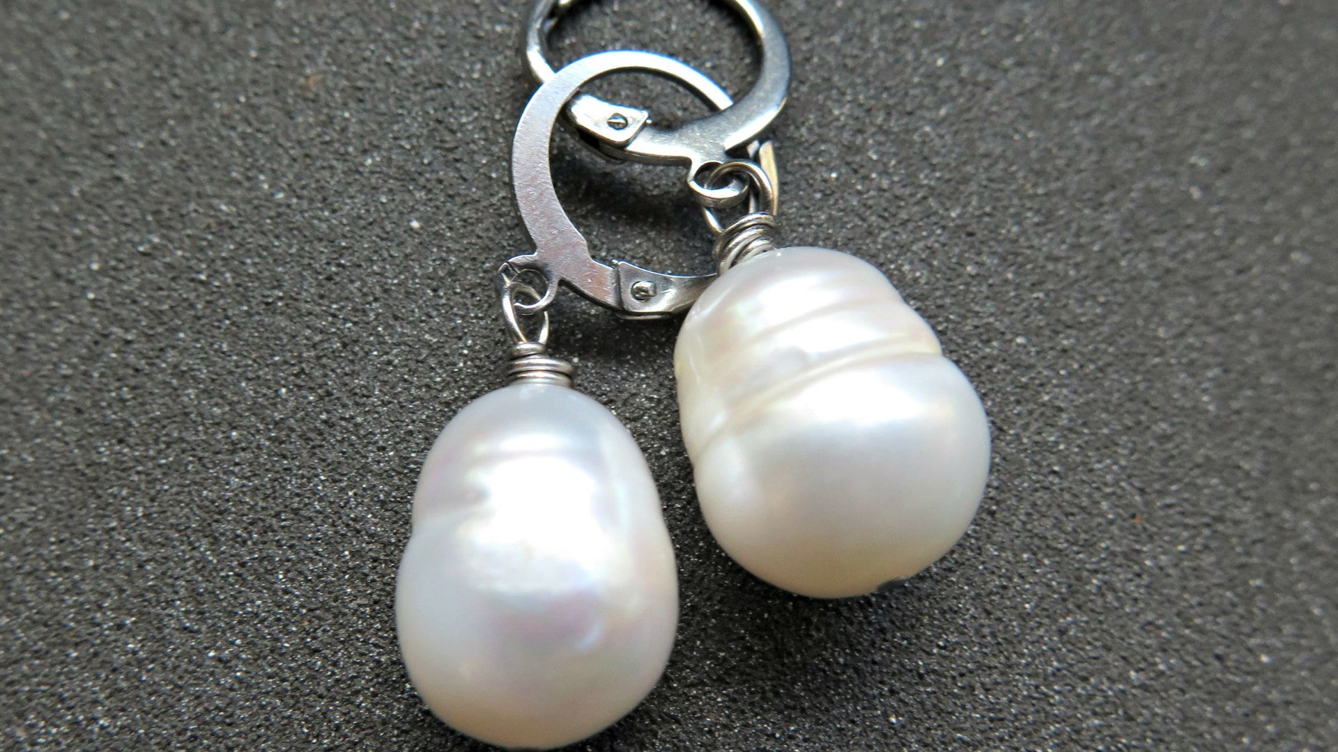 white pearl drop earrings. large freshwater pearl dangles. hypoallergenic stainless steel hoops. made in Canada.