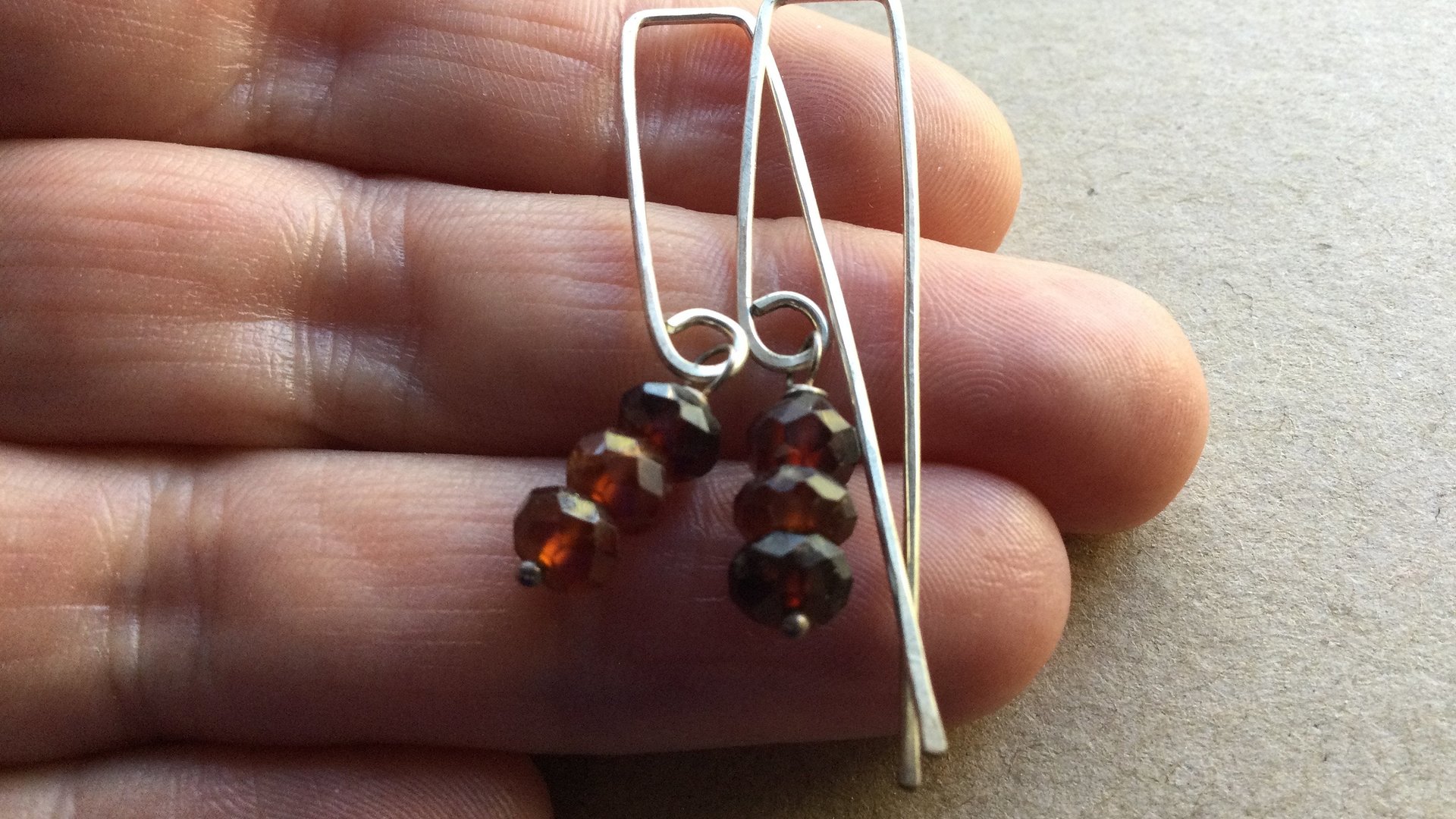 hessonite garnet earrings. burnt red stone jewelry. silver dangle earings.