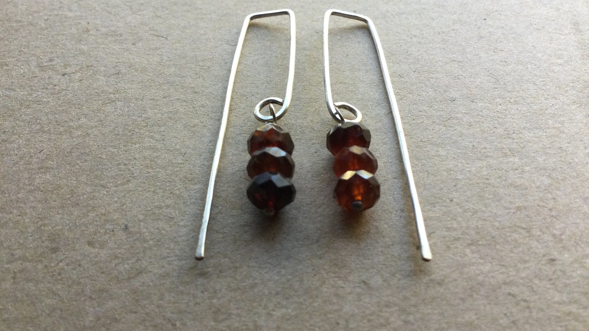 hessonite garnet earrings. burnt red stone jewelry. silver dangle earings.