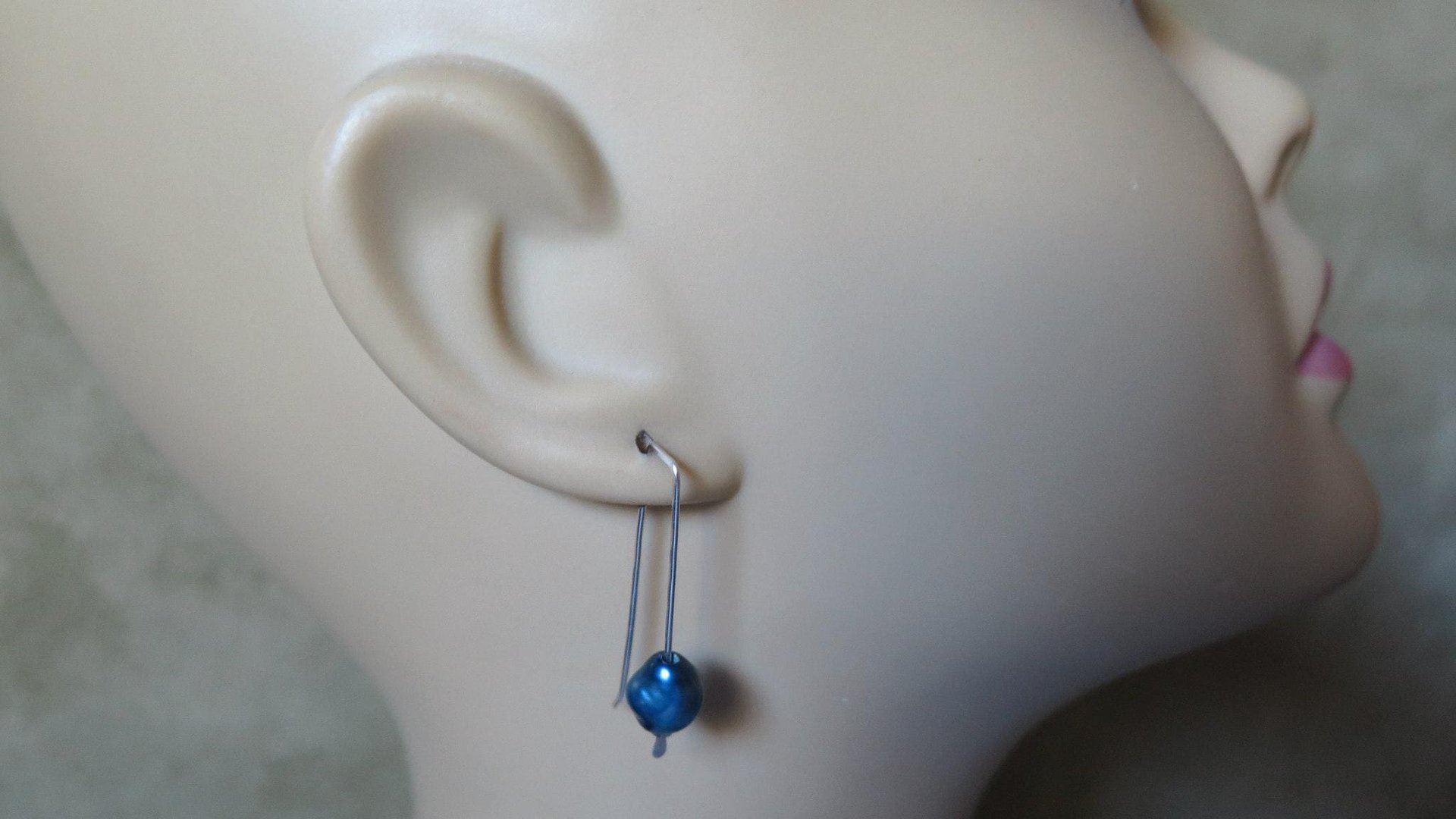 blue pearl earrings in sterling silver. modern freshwater pearl jewelry. 1 1/2” drop earrings. made in Calgary, Canada